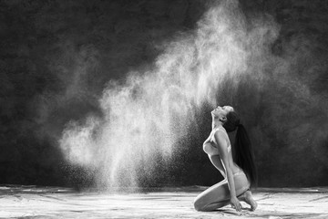 Black and white portrait of young dancer with white flour flipping from her hair