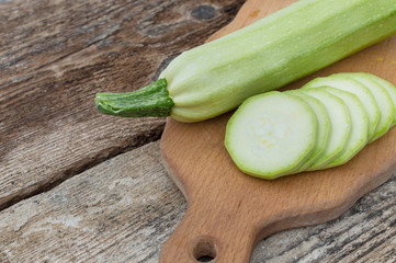 fresh zucchini on a board for cutting