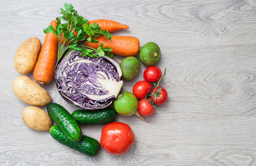 A crop of fresh vegetables on a wooden table. The concept of farming.