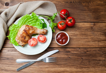 Fried chicken with vegetables on a wooden background. Banner for the restaurant