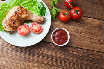 Fried chicken with vegetables on a wooden background. Banner for the restaurant