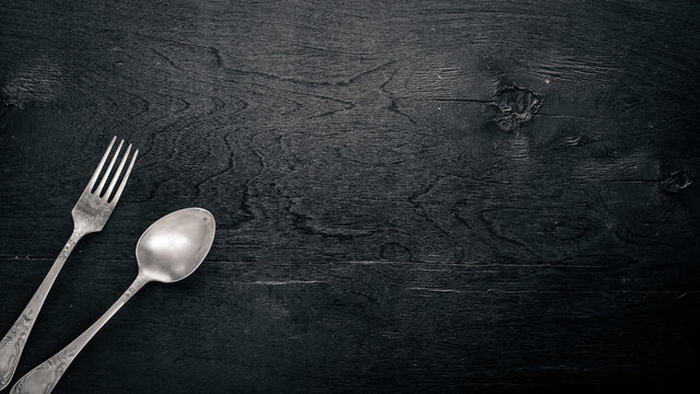 Cutlery. Fork And Spoon. On Wooden Background. Top View.