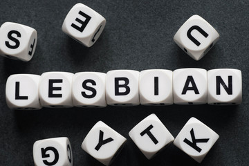 word lesbian on toy cubes