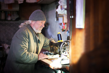 Man sewing at home