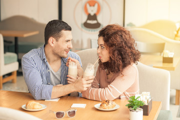 Nice looking couple in cafe