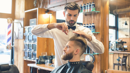Young Man in Barbershop Hair Care Service Concept