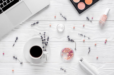 set of cosmetics for women with lavender office background top view