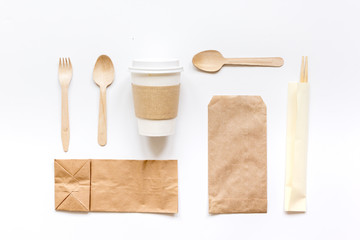 food delivery workdesk with paper bags and plastic cup table background top view mock-up