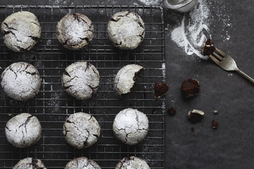 Chocolate Cookies Decorated with Icing Sugar on Slate Table