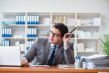 Angry aggressive businessman in the office