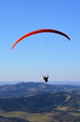 Paragliding in the blue sky