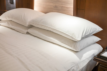 Comfortable pillows and bed .