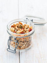 Granola with nuts in a jar.  Muesli