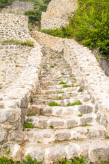 Fototapeta na wymiar Stone stairs of old abandoned medieval Kalnik fortress ruins in Prigorje, Croatia 