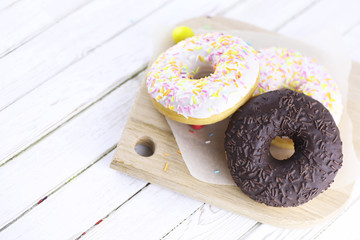 Chocolate Donut on a wooden white background