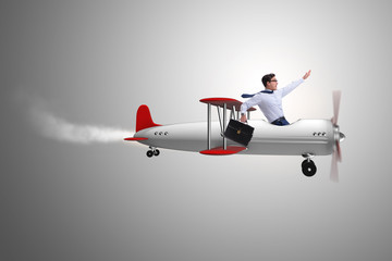 Businessman flying on vintage old airplane
