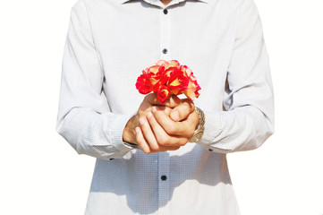 Man holding a small bouquet of roses in two hands