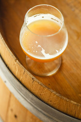 Wheat ale on a wooden barrel