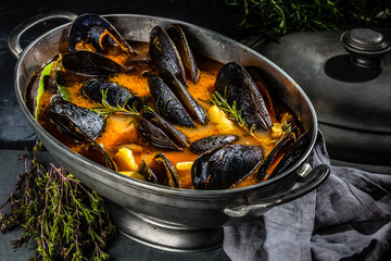 Pot of seafood soup. Mussels soup