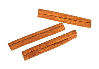 Three cinnamon sticks on white background, top view