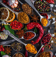 Spices and herbs in metal bowls. Food and cuisine ingredients. Colorful natural additives.