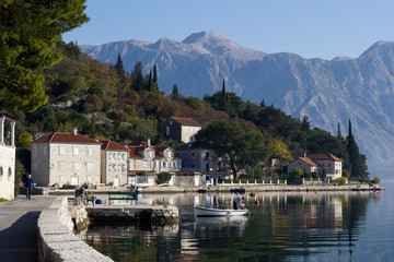 Fototapeta na wymiar Embankment in Perast, Montenegro sea view and mountain view