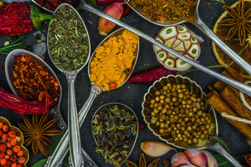 Spices and herbs in metal bowls. Food and cuisine ingredients. Colorful natural additives.
