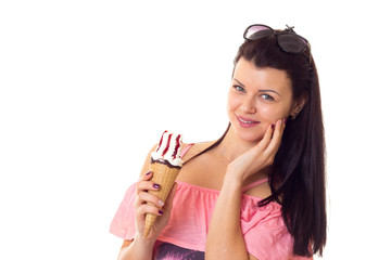 Woman in dress with sunglasses holding ice-cream