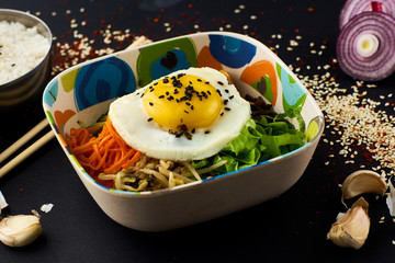 Bibimbap. Traditional korean cuisine. Mixed rice with meat and assorted vegetables.