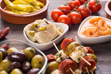 Spanish tapas starters on wooden table