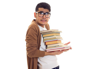 Young man in glasses with books