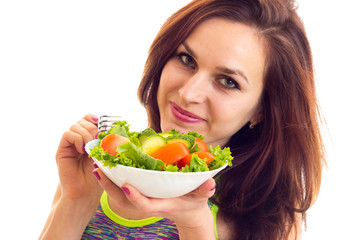 Sportive woman holding salad 