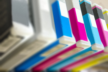 Inkjet printer. Close up on CMYK cartridge. Shallow DOF