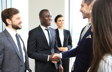 Business people shaking hands, finishing up a meeting.
