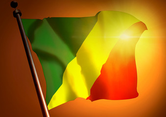 winner waving Congo Republic flag against the sunset