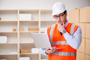 Man working in postal parcel delivery service office