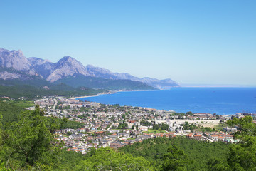 View of the town of Kemer from the top of the mountain. Blue sea, sky, mountains and city. Turkey