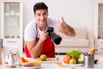 Food photographer taking photos in kitchen