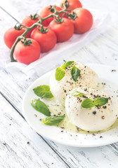 Mozzarella with cherry tomatoes and basil leaves