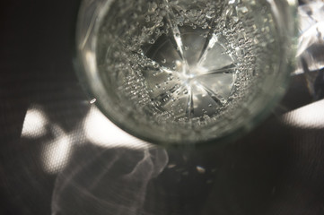 transparent faceted glass with bubbly water