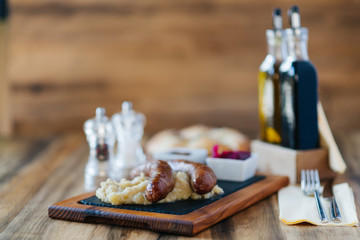 Homemade sausages on the old table.