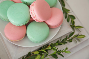 Plate with macarons on wooden stand