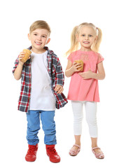 Cute little children eating ice cream on white background