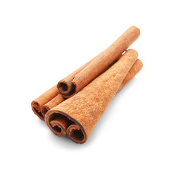 Heap of cinnamon sticks on white background