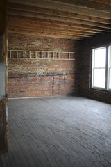 Fototapeta na wymiar Vintage Loft Space with Exposed Brick and Beams