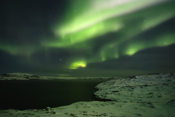 Fototapeta na wymiar Northern lights. Aurora borealis nature landscape at night