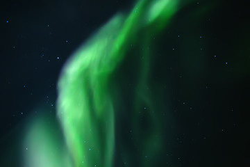 Naklejka na ściany i meble Northern lights. Aurora borealis nature landscape at night