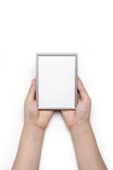 woman hand hold a photo frame isolated white.