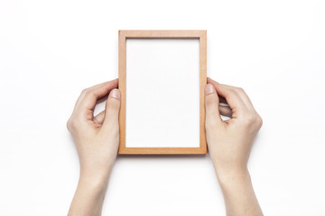 woman hand hold a photo frame isolated white.