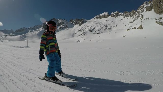 Little boy skiing.
Little boy enjoying skiing. Child learning to ski.